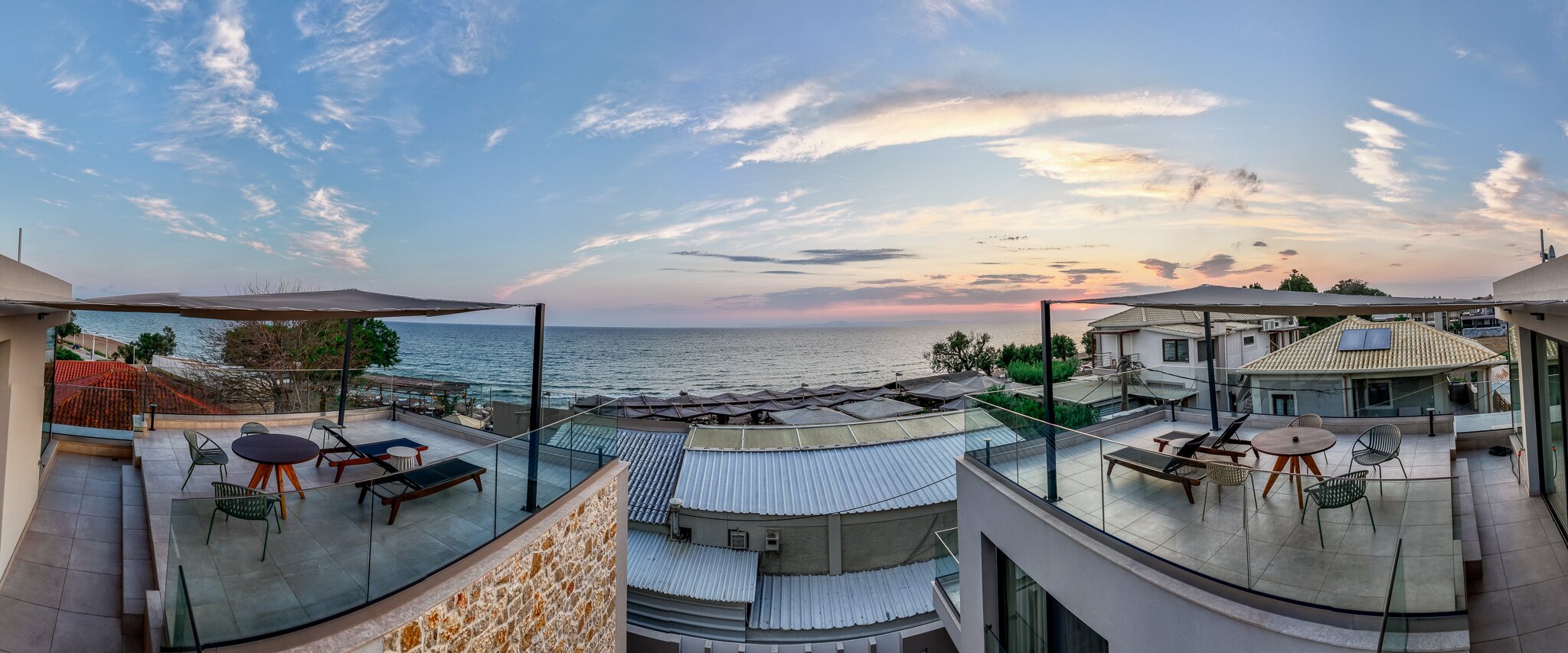 Aerial view of Aetheria North above the Ionian Sea at sunset